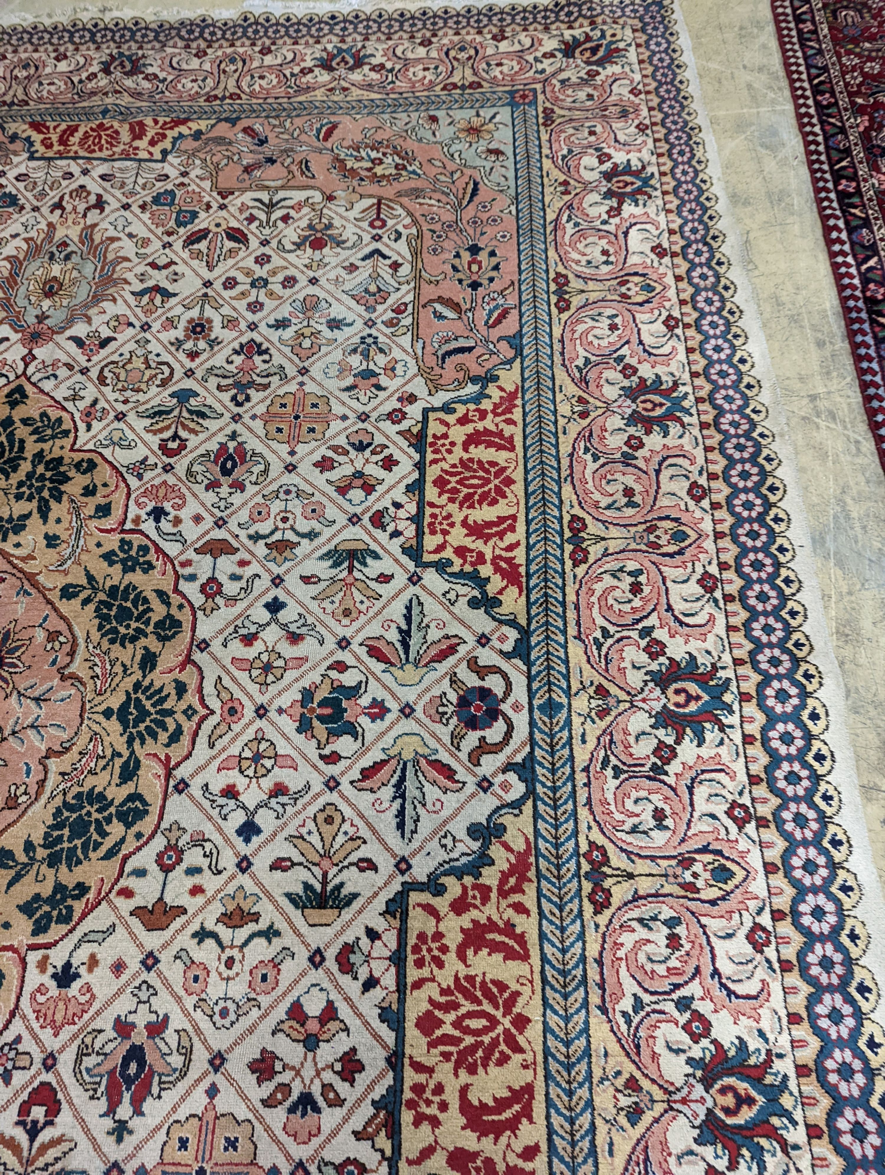 A Tabriz ivory ground carpet, 425 x 306cm